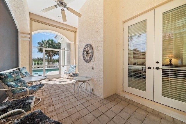 view of patio featuring ceiling fan and french doors