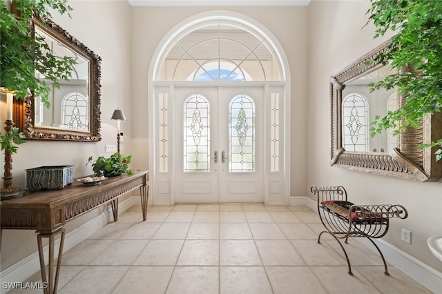 tiled foyer entrance featuring french doors