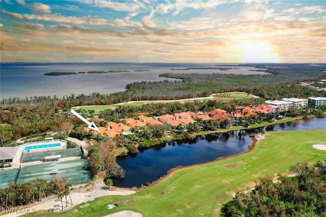 aerial view at dusk with a water view