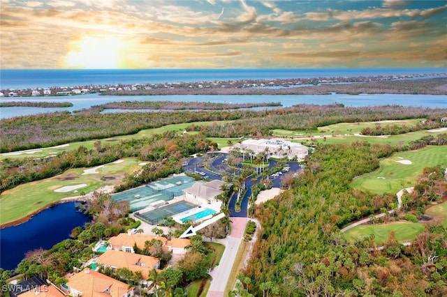 aerial view at dusk with a water view