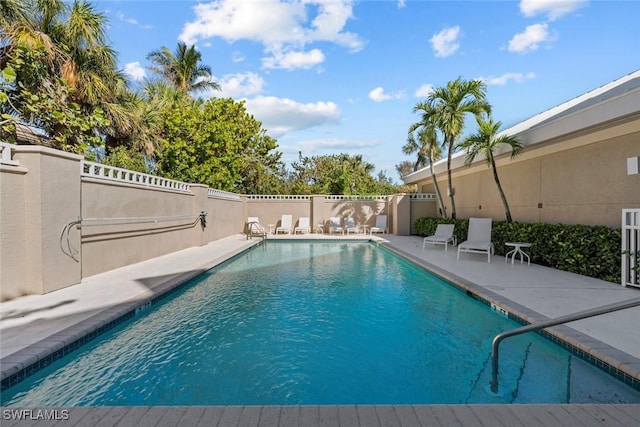 view of swimming pool featuring a patio