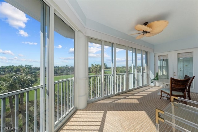 sunroom with ceiling fan and french doors