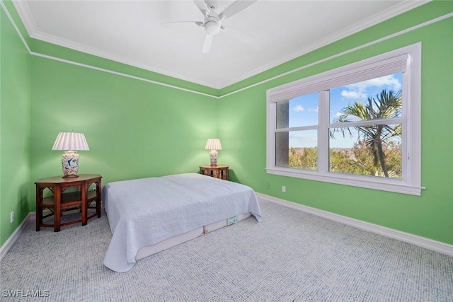 bedroom with carpet, ceiling fan, and crown molding