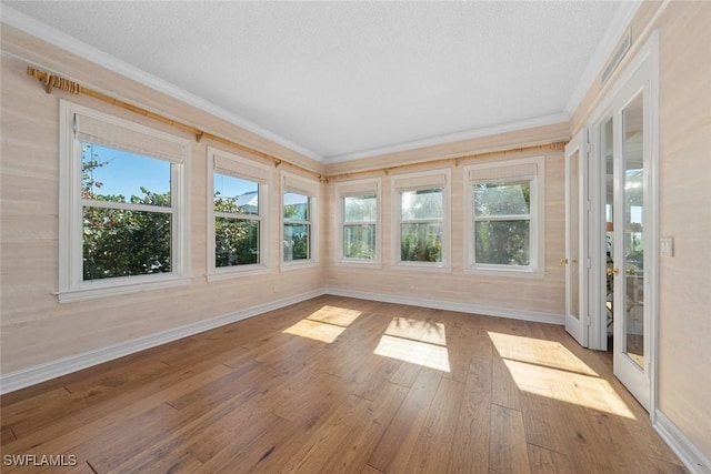 unfurnished sunroom featuring plenty of natural light