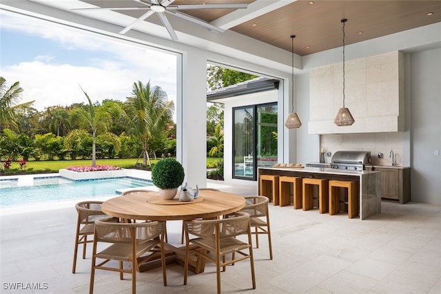 interior space with beamed ceiling, ceiling fan, wood ceiling, and sink