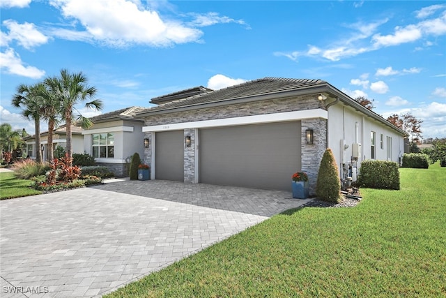 view of front of house with a front lawn and a garage