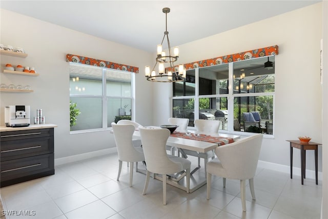 tiled dining space with an inviting chandelier