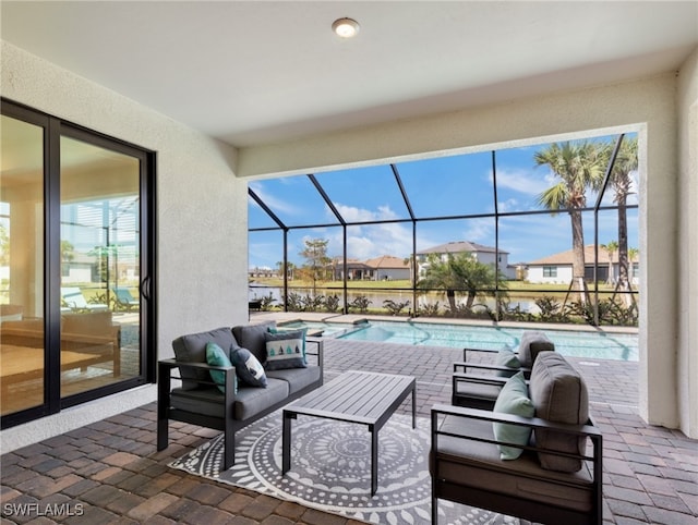 view of patio with an outdoor living space and a lanai