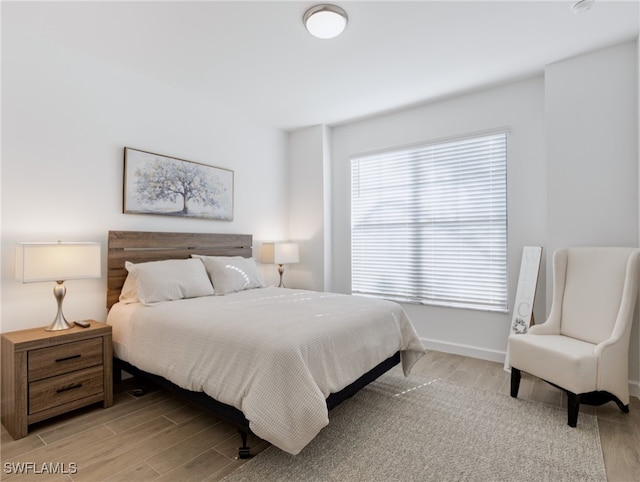 bedroom with light hardwood / wood-style floors