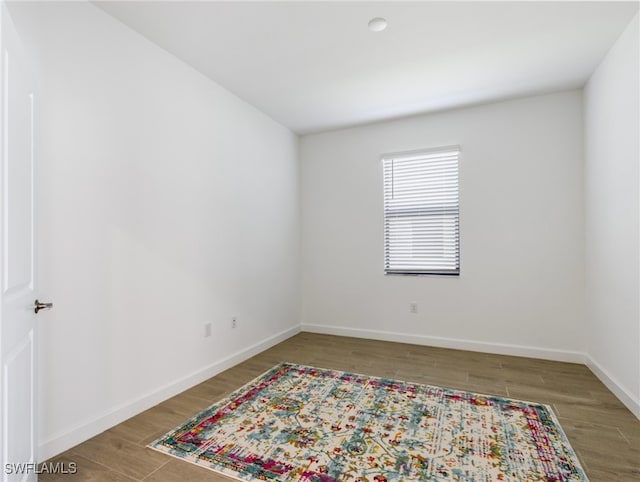 spare room featuring hardwood / wood-style floors