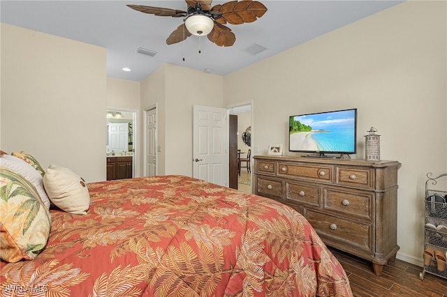 bedroom featuring ensuite bath, dark hardwood / wood-style flooring, and ceiling fan