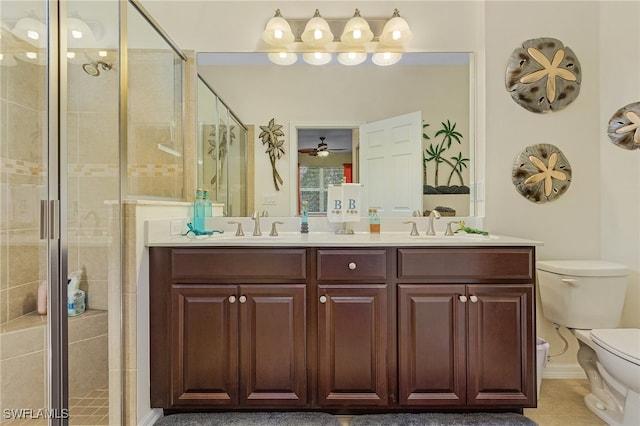 bathroom with vanity, tile patterned floors, toilet, and walk in shower