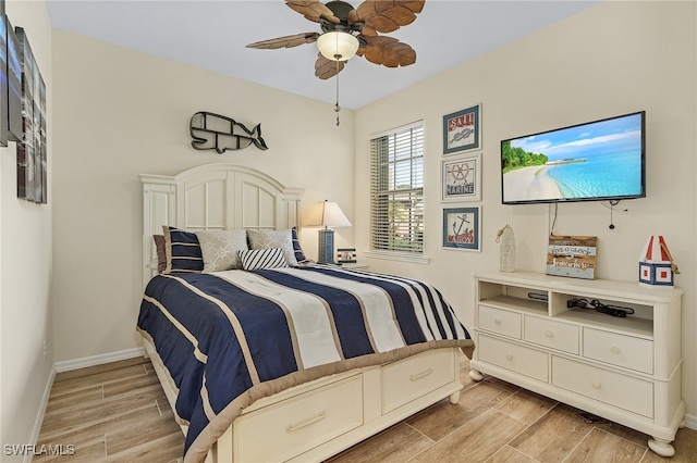 bedroom featuring light hardwood / wood-style floors and ceiling fan