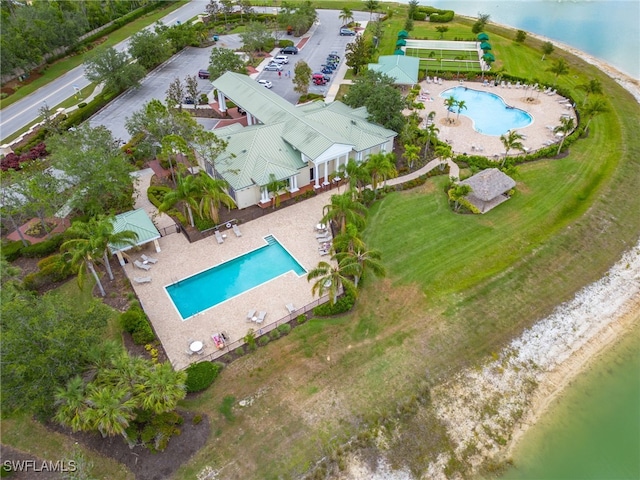 birds eye view of property with a water view