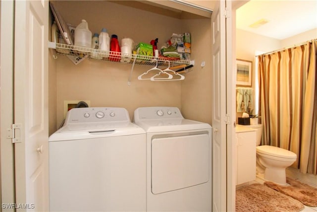 laundry area featuring washing machine and dryer