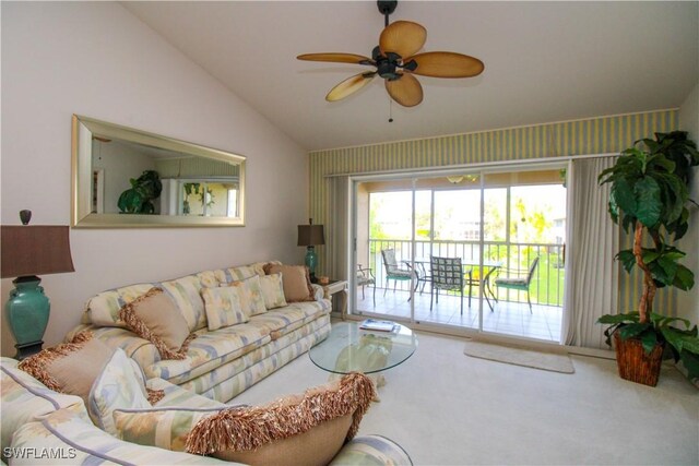 living room with carpet, ceiling fan, and lofted ceiling