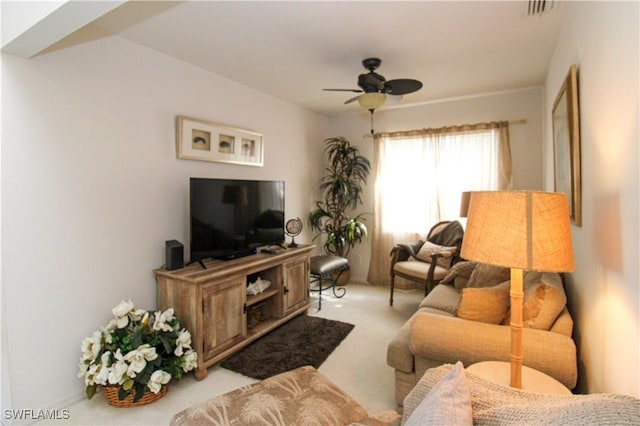 living room featuring light colored carpet and ceiling fan