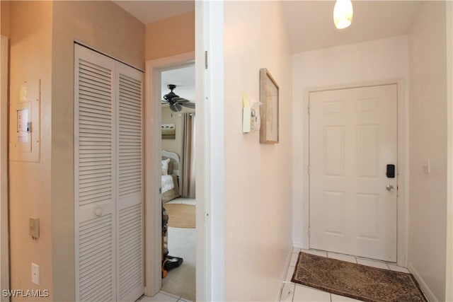 hall with light tile patterned flooring