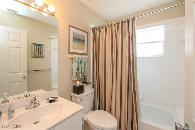 full bathroom featuring vanity, toilet, and shower / bathtub combination with curtain