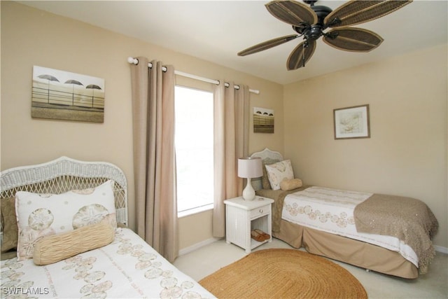 bedroom with multiple windows and ceiling fan