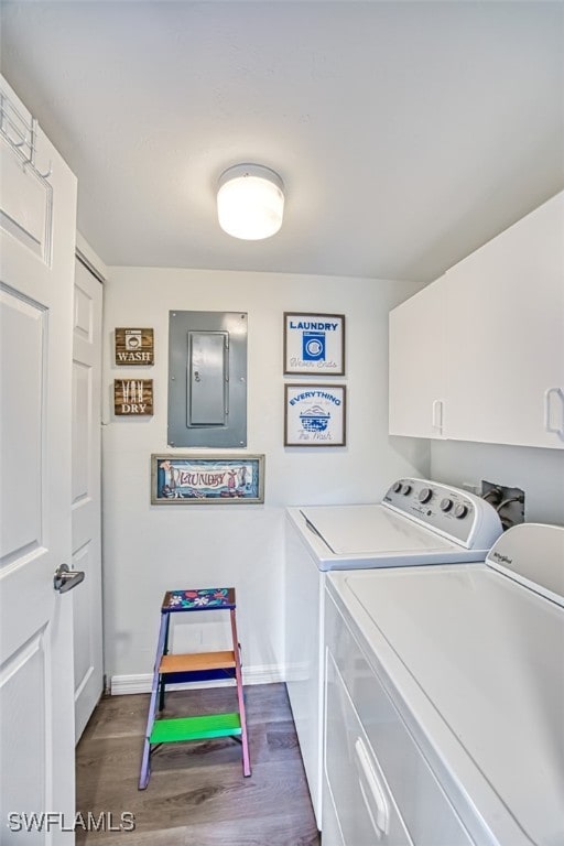 laundry area with cabinets, independent washer and dryer, electric panel, and dark hardwood / wood-style flooring