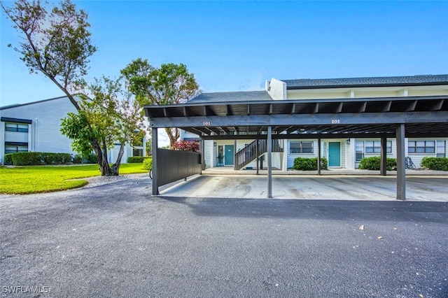 view of parking / parking lot featuring a carport