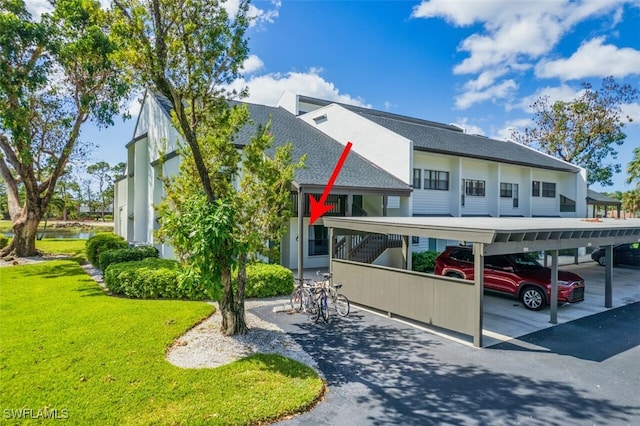 view of front of house featuring a front yard and a carport