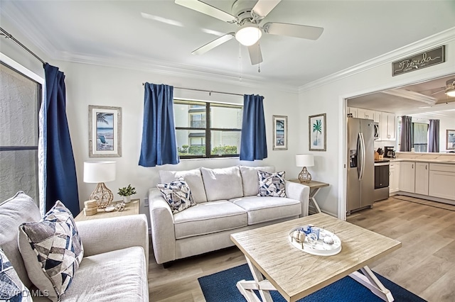 living room featuring crown molding, light hardwood / wood-style flooring, and ceiling fan