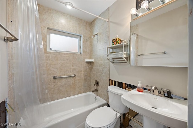 full bathroom with shower / bath combination with curtain, toilet, and sink