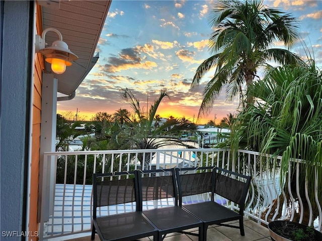 view of balcony at dusk