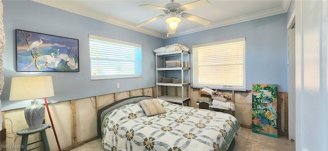 bedroom with crown molding, ceiling fan, and carpet