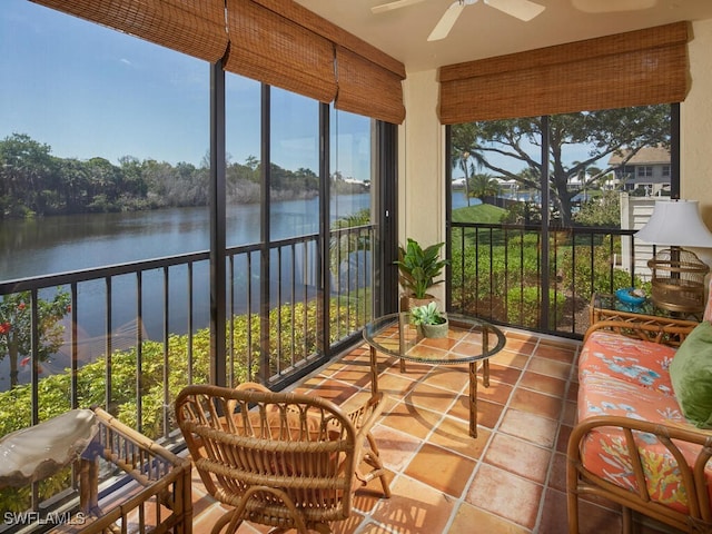 4021 Whiskey Pointe Ln Unit 202, Bonita Springs, FL 34134 - sunroom featuring a ceiling fan, a water view, and tile patterned flooring