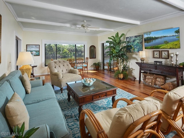 living room with ceiling fan, ornamental molding, beam ceiling, and hardwood / wood-style floors