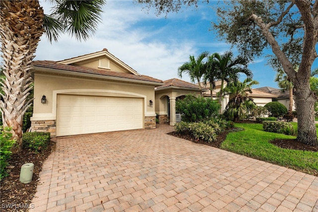 view of front facade with a front lawn and a garage