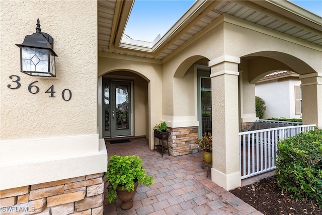 property entrance featuring covered porch