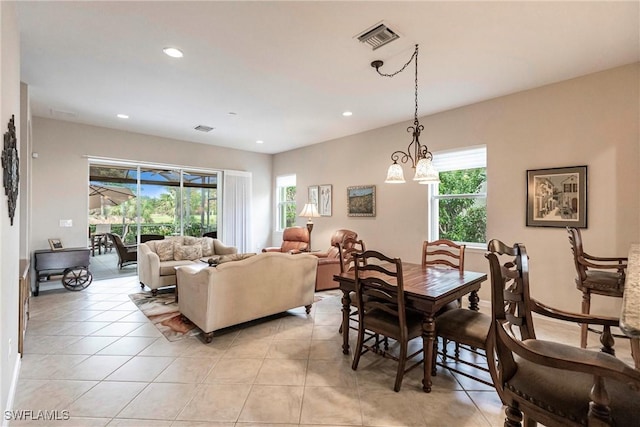 dining area with visible vents, light tile patterned floors, and a healthy amount of sunlight