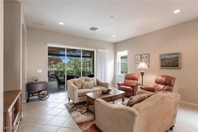 living room featuring visible vents, recessed lighting, baseboards, and light tile patterned floors