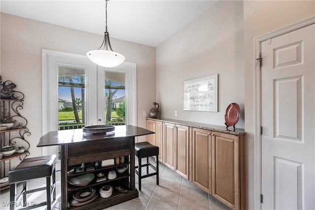 dining area with light tile patterned floors