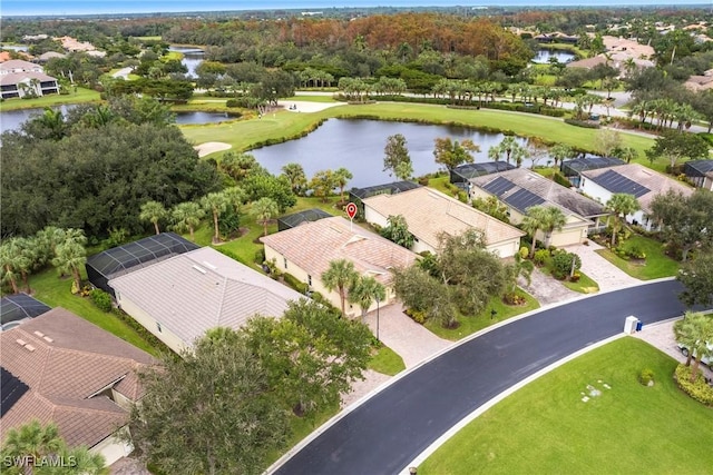 bird's eye view featuring a residential view and a water view