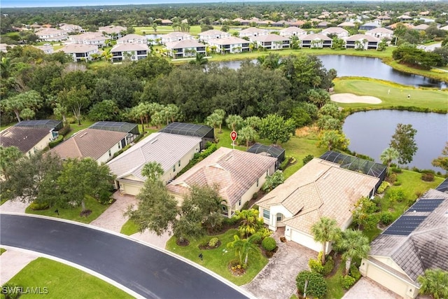 drone / aerial view featuring a water view and a residential view
