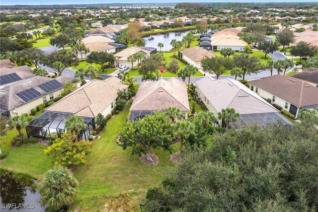 birds eye view of property featuring a water view and a residential view