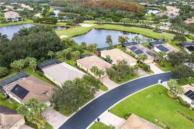 bird's eye view featuring a water view, view of golf course, and a residential view