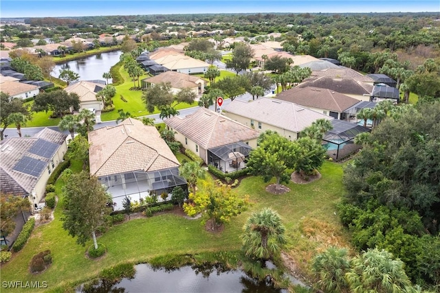 bird's eye view featuring a residential view and a water view