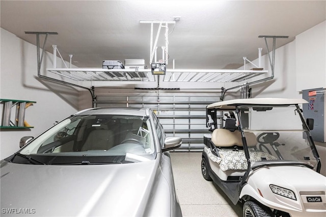 garage featuring a garage door opener