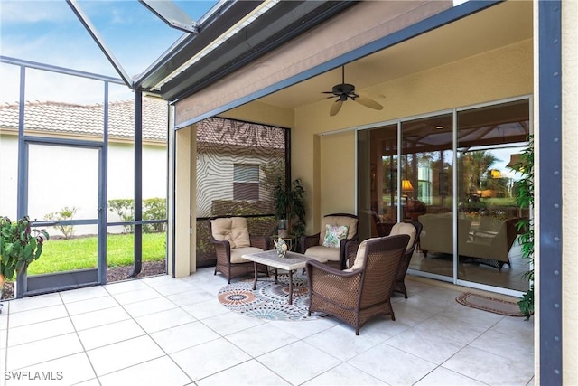 sunroom with an outdoor living space and a ceiling fan