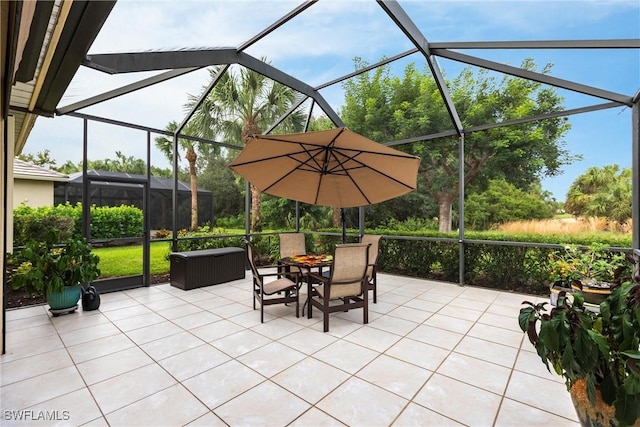 view of patio / terrace featuring glass enclosure