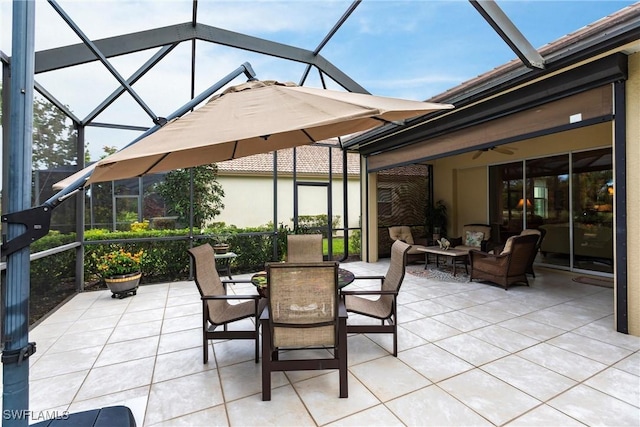 sunroom / solarium with outdoor dining space, ceiling fan, and an outdoor living space