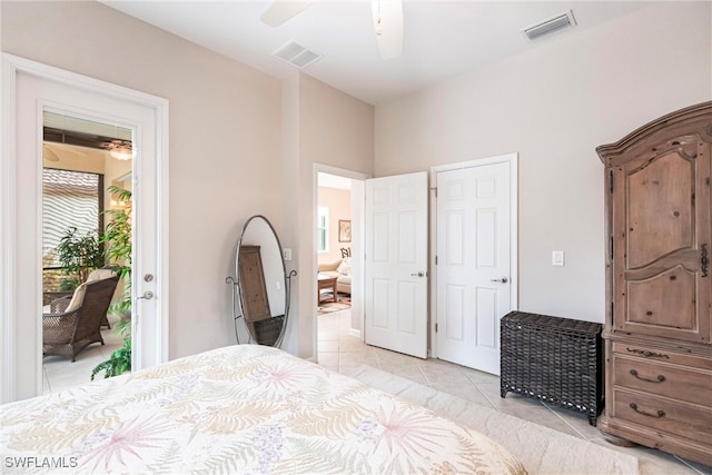 bedroom with ceiling fan, light tile patterned floors, and access to exterior