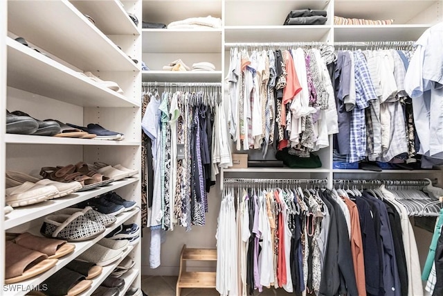 spacious closet featuring tile patterned floors