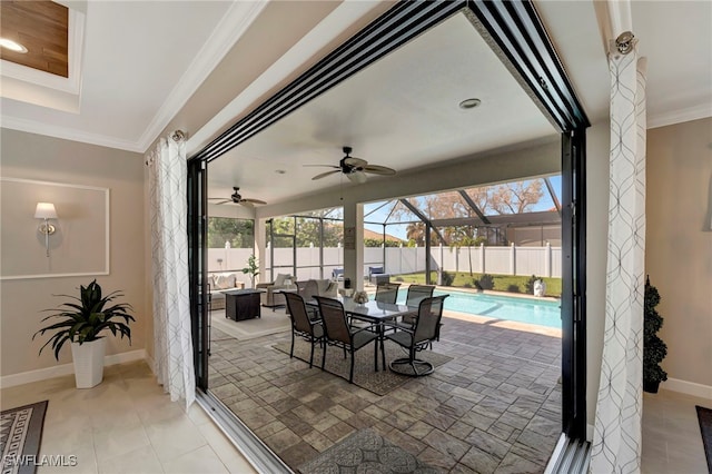 exterior space featuring a lanai, a fenced in pool, and ceiling fan